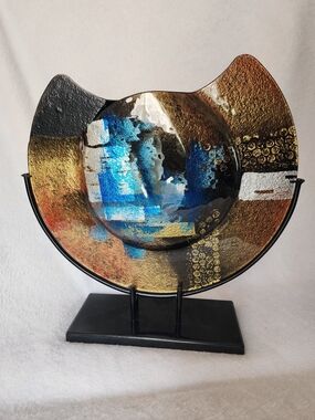 Jasmine Art Glass cutaway vase featuring abstract blue, gold, and black patterns